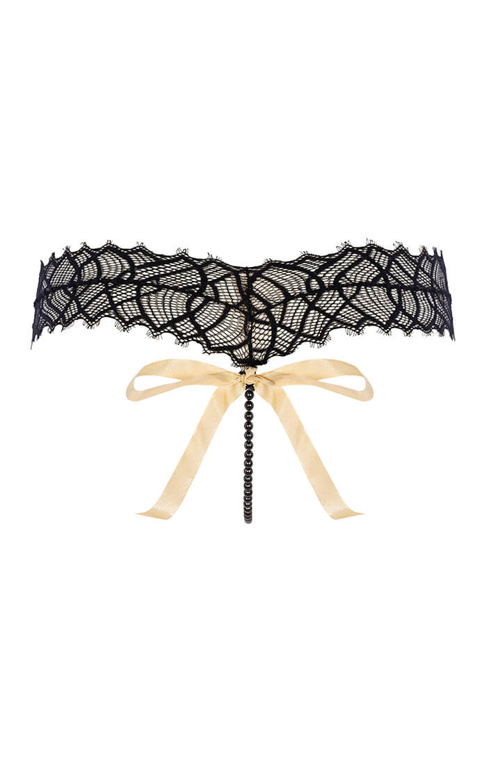 Bagfra-visning af G-string med perlesnor og guldfarvet lurex-sløjfe fra COAX Copenhagen
